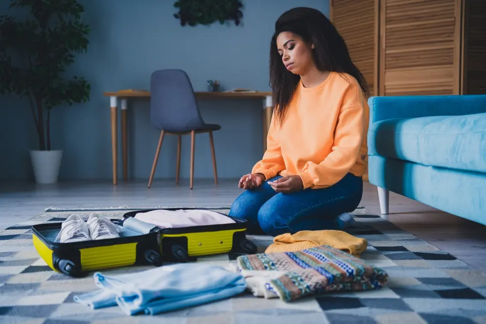 A stressed looking lady planning her travel