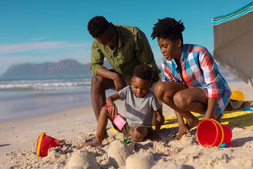 Black African family at the beach.