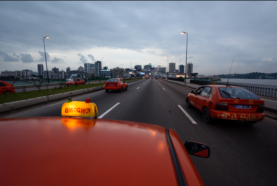 Abidjan, Cote d'Ivoire The skyline at dusk from an approaching taxi