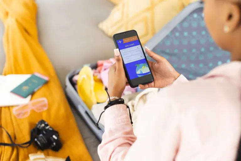 A lady booking flight on her phone