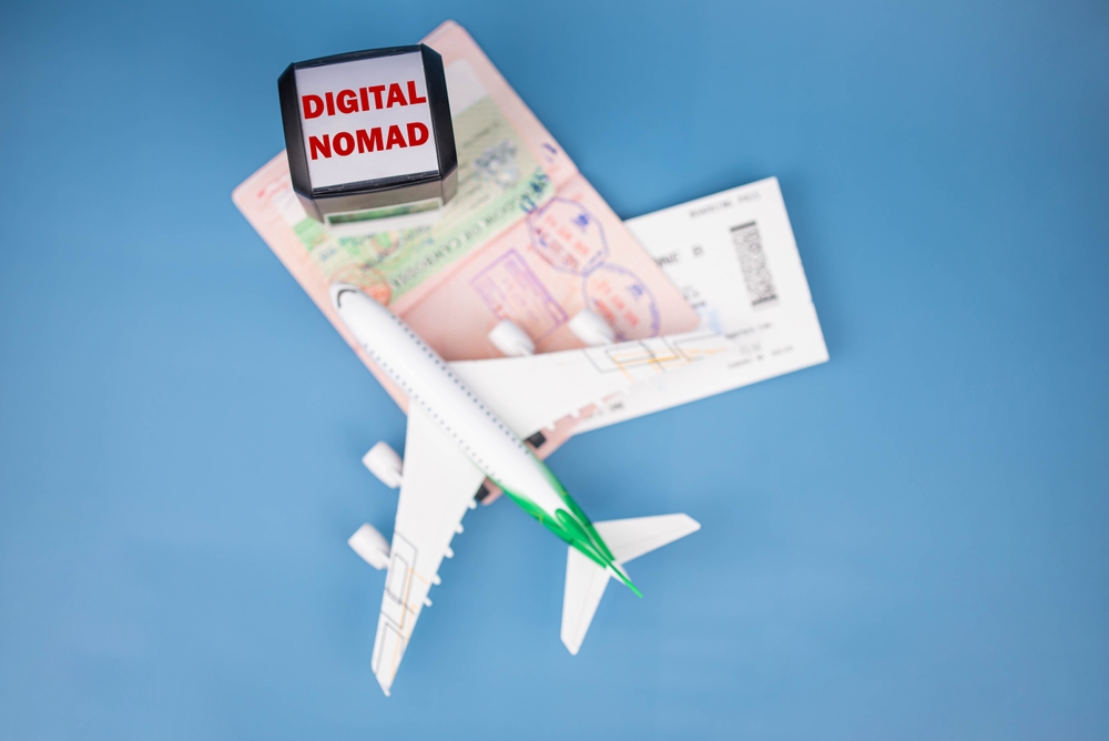 Travel passport pages, Visa stamps, stamper “Digital Nomad visa” and plane. Immigration, emigration, visa application and tourism concept.