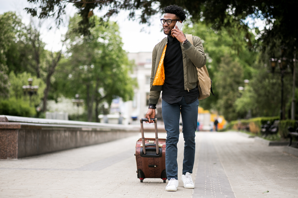 African man travelling on a Cheap summer flights from Nigeria 