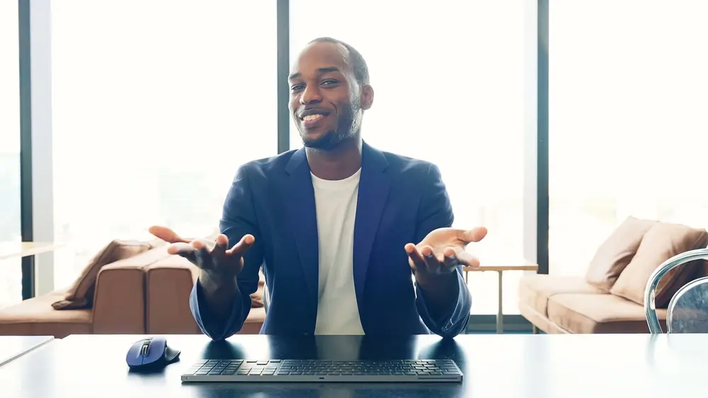 A black man explaining reselling Travel as one of the Best Small Business Ideas in Nigeria
