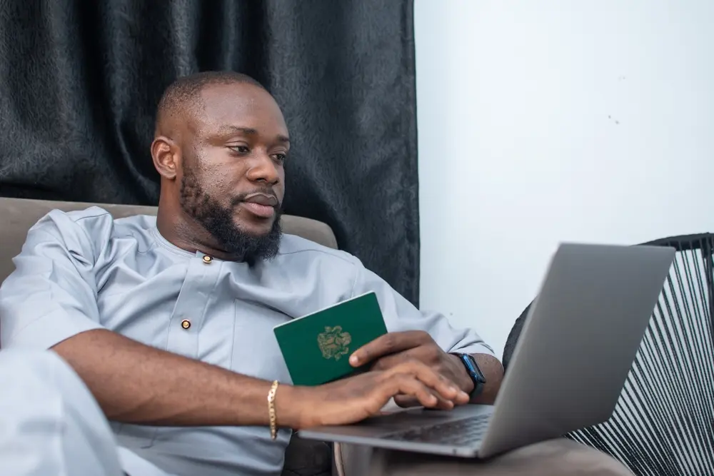 A black man preparing to book a flight online